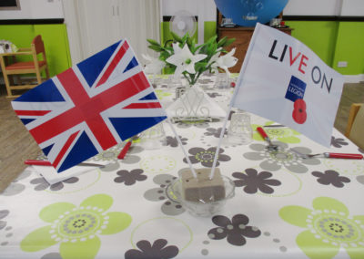 St Winifreds dining table adorned with Royal British Legion flags