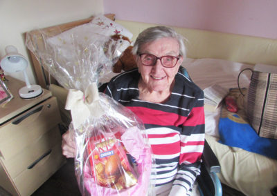 Resident at St Winifreds receiving a gift Easter egg