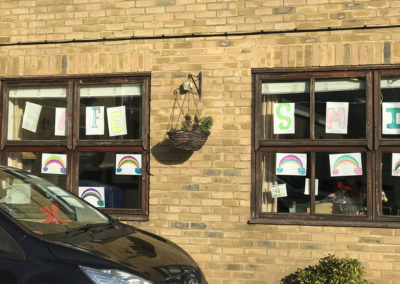 Rainbow and smile posters in the windows at St Winifreds Residential Care Home 1
