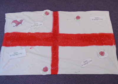 Handmade St George's Day flag made by St Winifreds Care Home residents