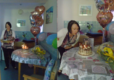 St Winifreds Care Home's Manager Hazel blowing out cake candle son her birthday