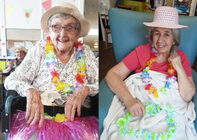 St Winifreds Residential Care Home ladies wearing flower garlands and sun hats
