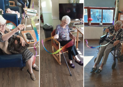 Residents twirling rhythm sticks at St Winifreds Care Home