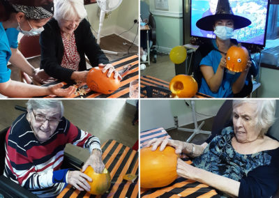 Residents scooping out Halloween pumpkins at St Winifreds Care Home