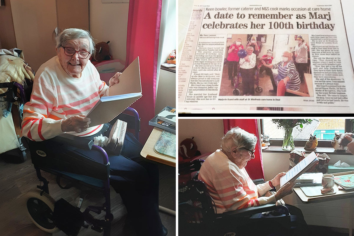 St Winifreds Care Home resident enjoying a photo album from her 100th birthday