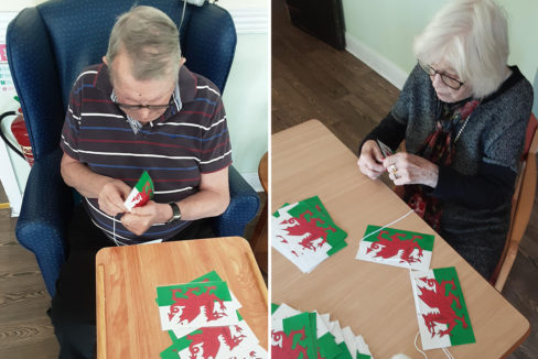 Threading bunting for St David's Day at St Winifreds Care Home