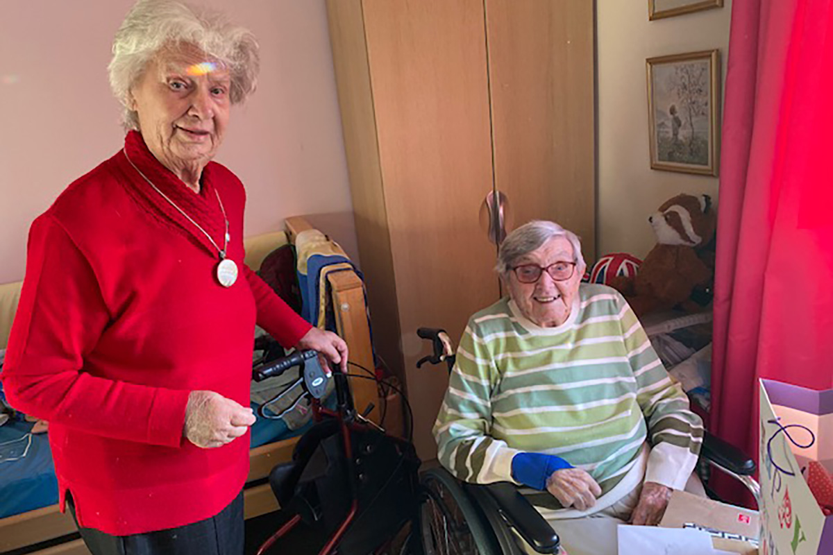 Resident enjoying her birthday with a friend at St Winifreds Care Home