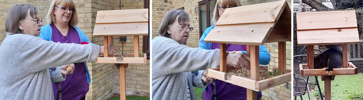 St Winifreds Care Home resident filler up her bird feeder
