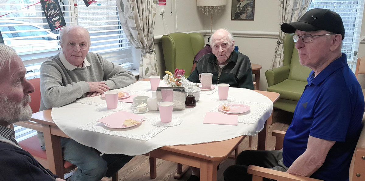 Gents enjoying Mother's Day afternoon tea at St Winifreds Care Home